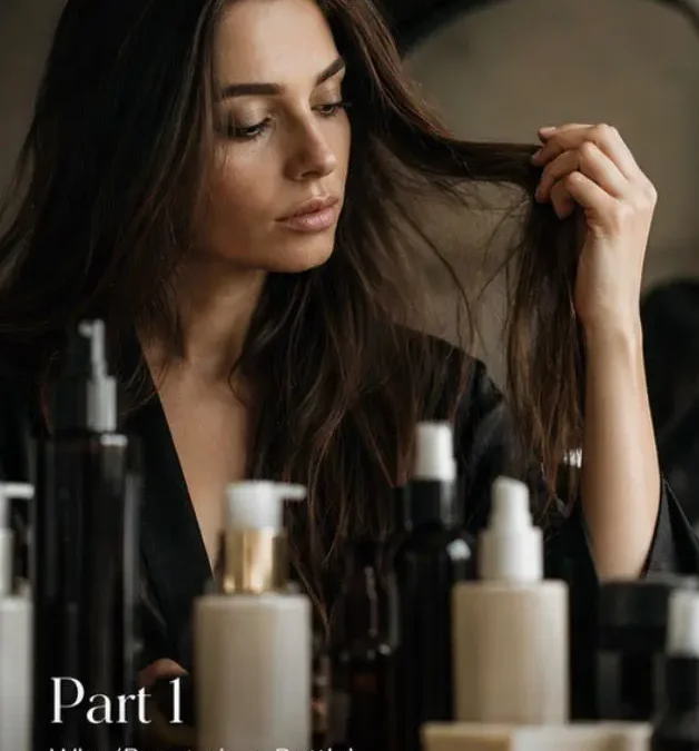Woman sitting at her dressing table looking in the mirror, चिंtemplating hair loss and dry, brittle hair condition